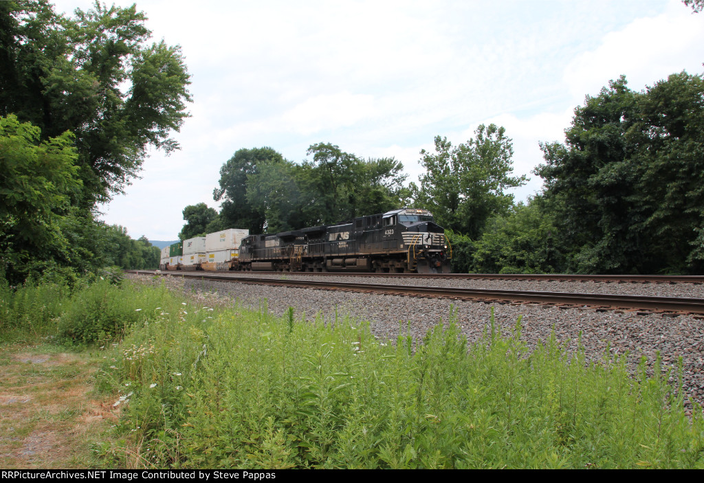NS 4323 heads an eastbound stack train at MP 116